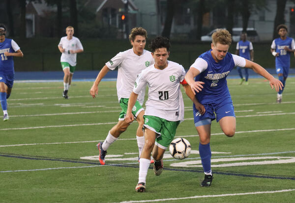 Albany High player on the turf against Schalmont