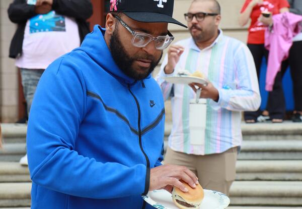 A Hackett employee participates in a staff BBQ.