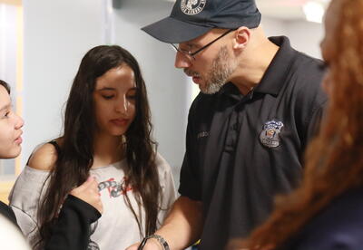 North �鶹Ӱ��'s school resource officers assists students on the first day of school.