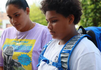 A mother and student check in for the first day of school.