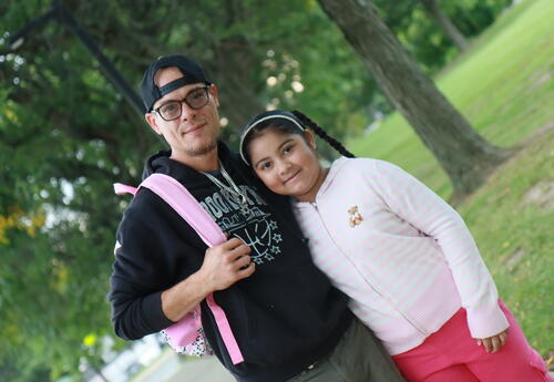 A father and student pose before the school day begins.