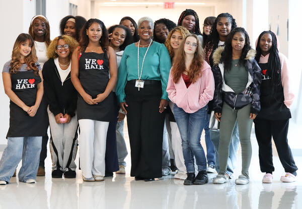 Group of cosmetology students and teacher