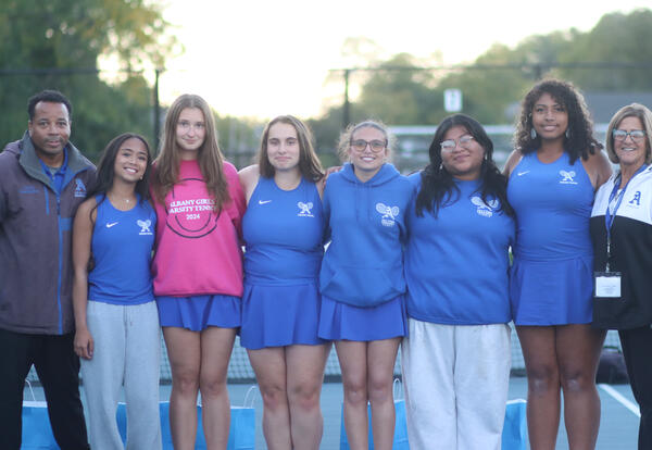 Girls' tennis seniors posing for a group photo