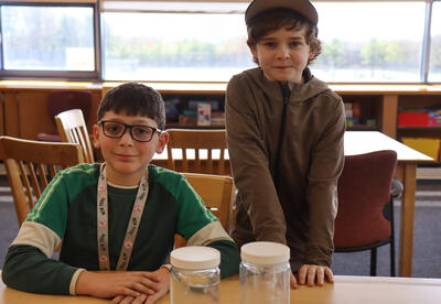 Two students share a science project.