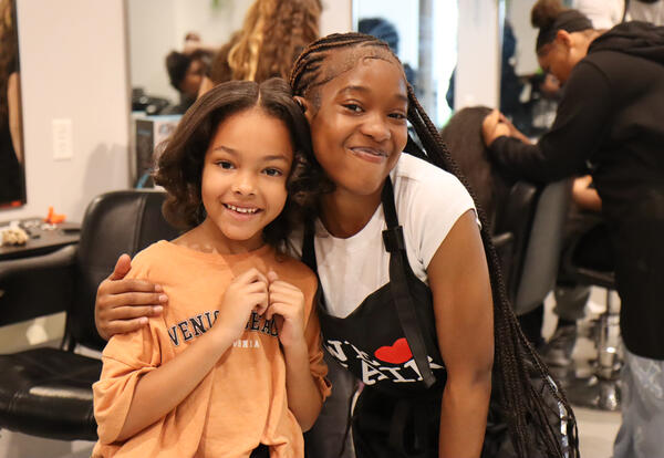TOAST student posing with her Albany High stylist