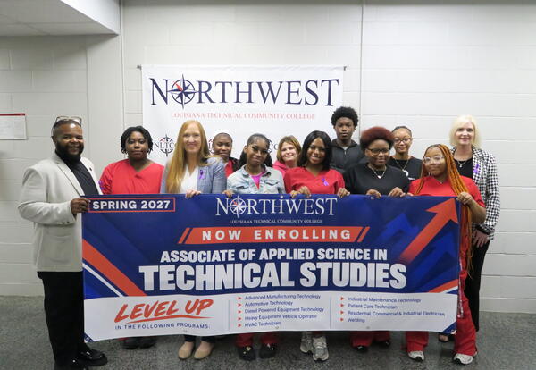 Students in front of banner