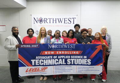 Students in front of banner