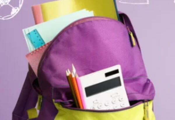 purple and yellow backpack with school supplies sticking out