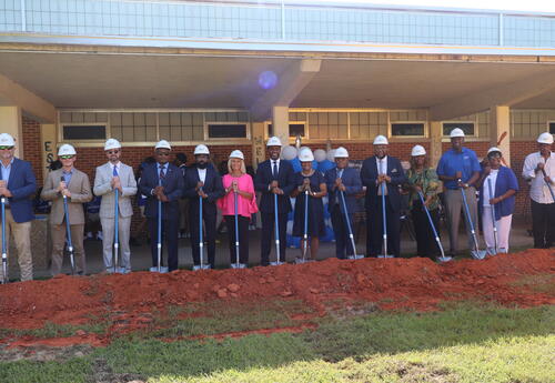 Ground Breaking, people holding shovels and wearing hard hats