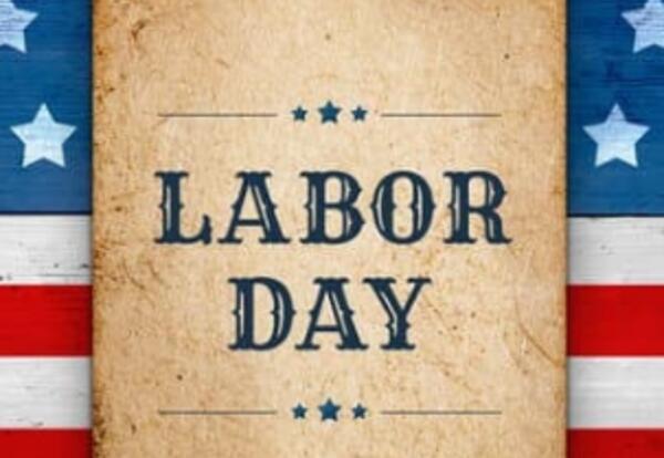 US Flag, with a brown paper bag slate in the center of it, that reads Labor Day