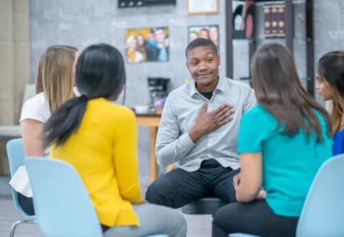 people sitting down listening to each other
