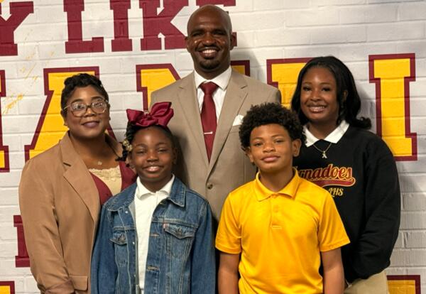 Photo of Broderick D. Hall, his wife, two daughter and his son