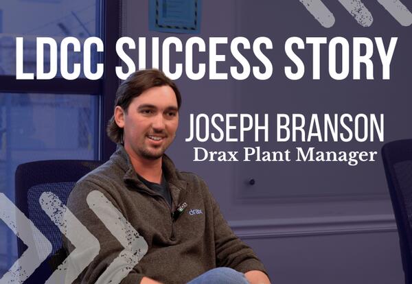 LDCC Success Story Joseph Branson, Drax Plant Manager. Photo of Joseph sitting and smiling.