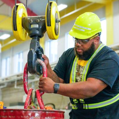 Manufacturing student with a crane