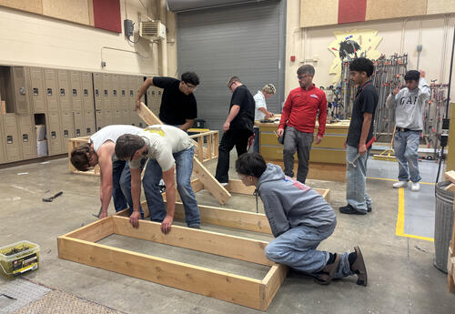 Construction Foundations instructor Eric Duffey helps students apply classroom learning to real-world building projects.