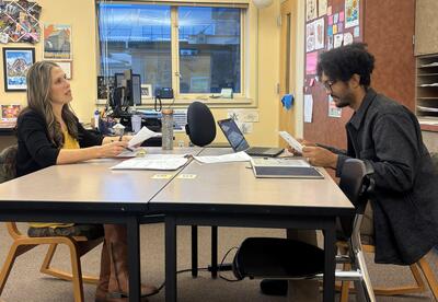 Eastmont Junior High English teachers John Bush and Heidi Barnes collaborate during planning time to design a student-choice research project connected to Unbroken.