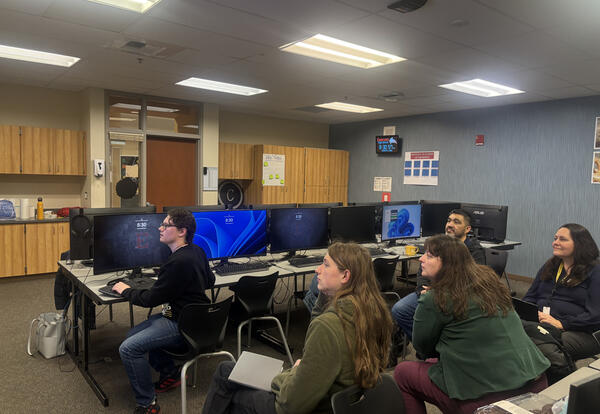 Eastmont High School students Torrin Stone and Zan Miakinkoff collaborate on an AI-powered tool developed through an internship with NCW Tech Alliance, supporting public health reporting for the Chelan-Douglas Health District.