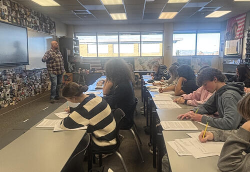 John Schmauder leads AP U.S. History students in analyzing historical claims and evidence, helping students build critical thinking skills in a college-level learning environment.