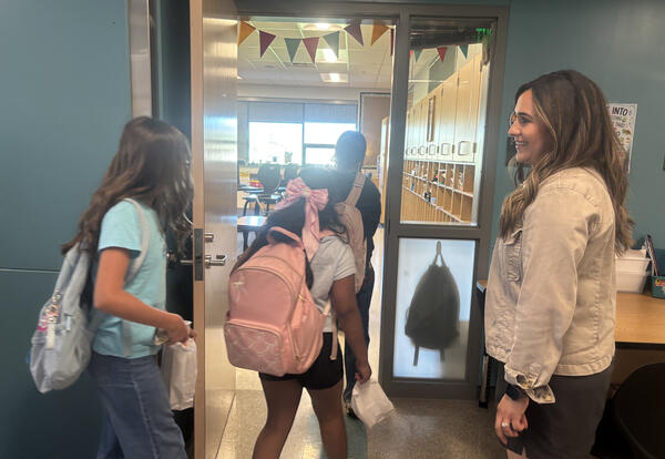 Rock Island Elementary teacher Gladys Farias greets students at her classroom door, helping build relationships and a sense of belonging.