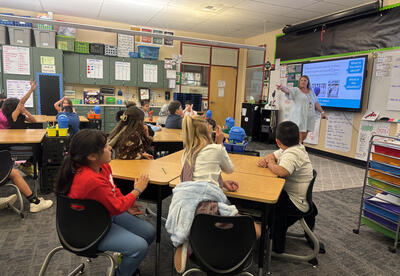 Hannah Veteto, Eastmont’s new Elementary Math Coach, models a word problem strategy in a 3rd grade classroom. “My goal is to foster engaging classrooms where mistakes are welcomed as part of learning,” says Veteto.