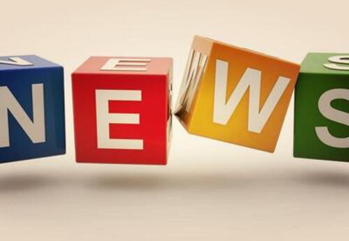 Colorful 3D blocks in blue, red, yellow, and green each display a large white letter, spelling the word NEWS against a light background.