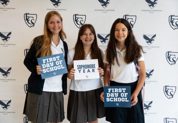 Students Holding First Day of School Signs
