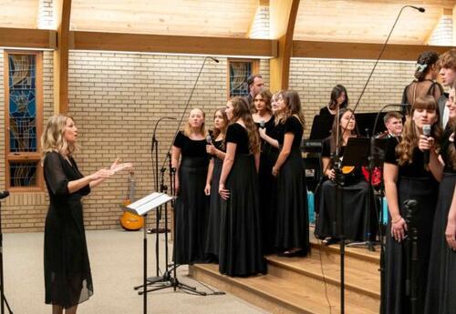 Choir and Choir Director at Fine Arts Event