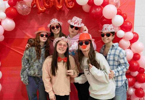 Girls on Valentines Day Posting with Red Balloons