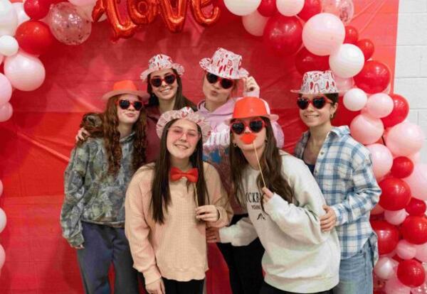 Girls on Valentines Day Posting with Red Balloons