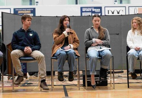 Graduates speaking in chapel service to current students