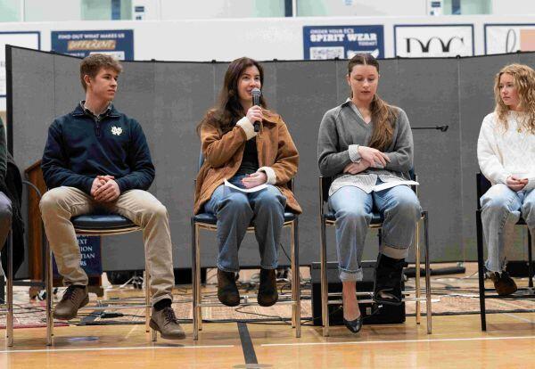 Graduates speaking in chapel service to current students