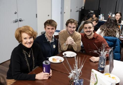 Alumni Men Sitting at Table with College Advisor