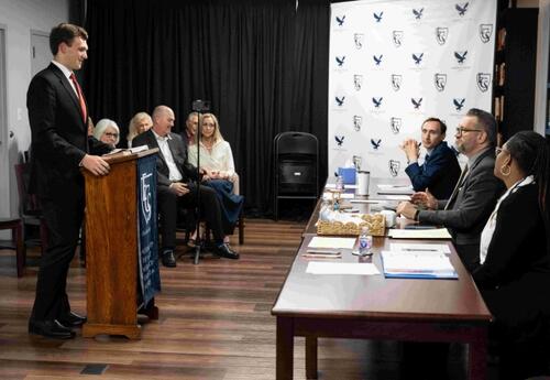 Student Speaking to a Committee from a podium