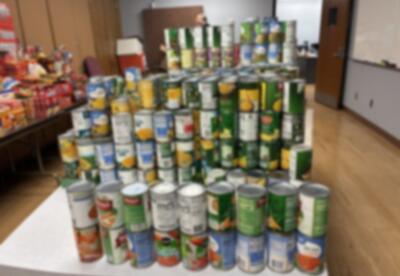Stacked canned goods collected for the School City of Hammond Community Food Drive.