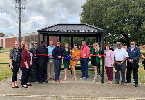 Ribbon cutting for new bus stop in front of Lafayette High School