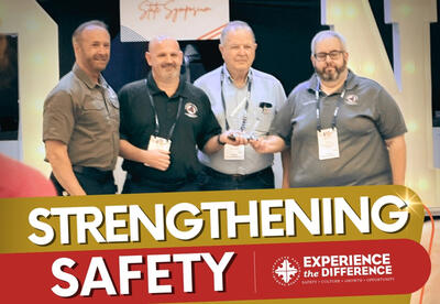 Four Men Receiving An Award