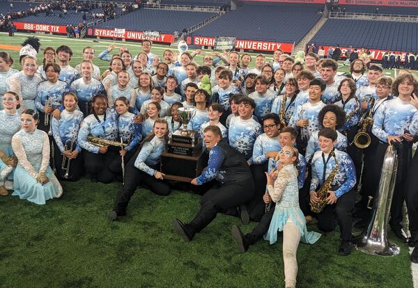 Liverpool Marching Band with state championship trophy