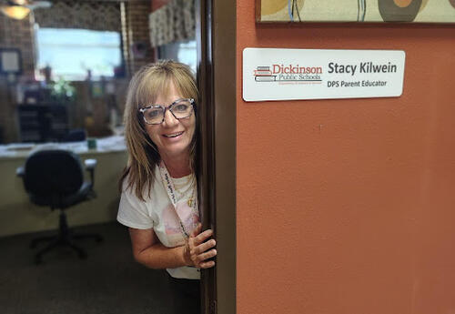 Stacy Kilwein posing outside of her office