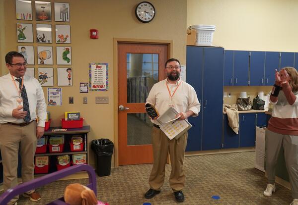 Peter Fritz, 2025–2026 Educator of the Year holding his award