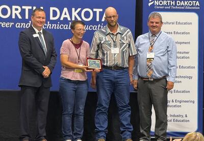 CTE staff accepts award