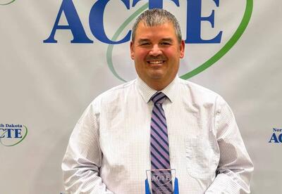 CTE Mr. Anderson accepts Award