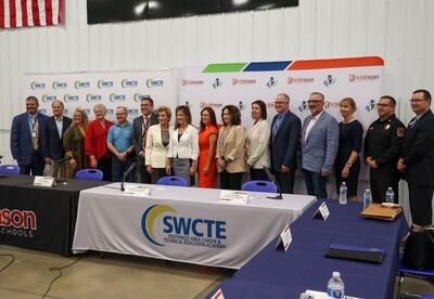 Group photo of Secretary McMahon and representaitves