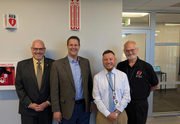 Three James Irwin Charter School administrators and US Congressman at PTEC.