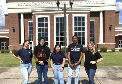 A group of students outside a River Parishes Community College campus building