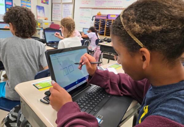 Student uses digital pen with a Chromebook for the first time.