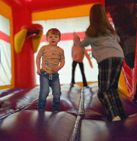 Children jumping in a bouncy house