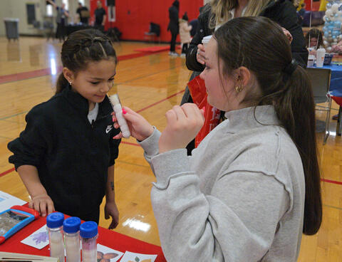 Student Trying to guess the scent in a tube