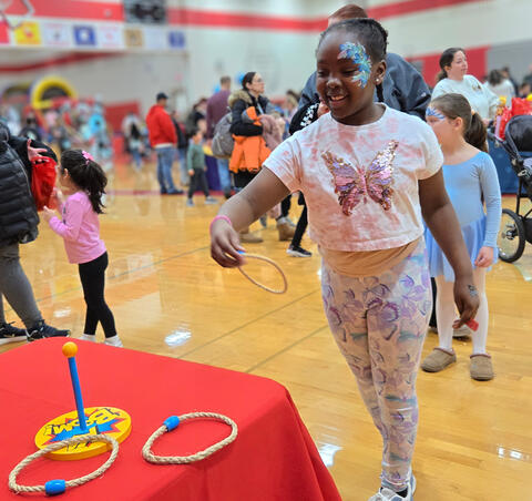 Girl playing ring toss