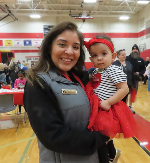 D123 leadership posing with a family member