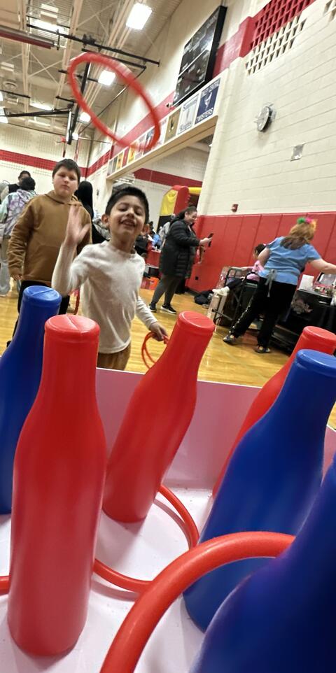 Student Playing a ring toss game